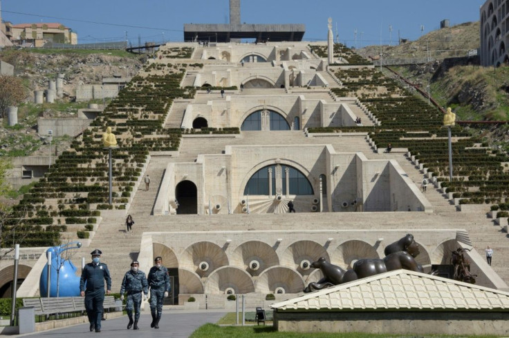 Police officers wearing face masks patrol the Cascade stairway in Yerevan amid the novel coronavirus pandemic.