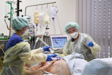 Medical staff take care of a Covid-19 patient in the intensive care unit at the community hospital in Magdeburg, eastern Germany