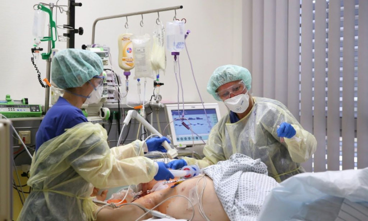 Medical staff take care of a Covid-19 patient in the intensive care unit at the community hospital in Magdeburg, eastern Germany