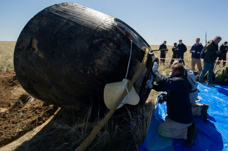 Two NASA astronauts and a Russian cosmonaut have made a safe return from the International Space Station