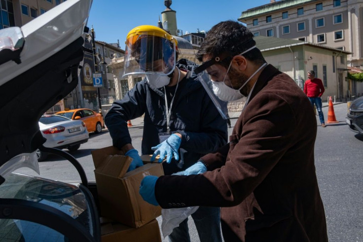 The group tours Istanbul neighbourhoods densely populated by African migrants in a car loaded with aid packages