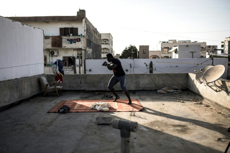 Diop trains with shadow fighting as he worries about takes precautions against an invisible foe