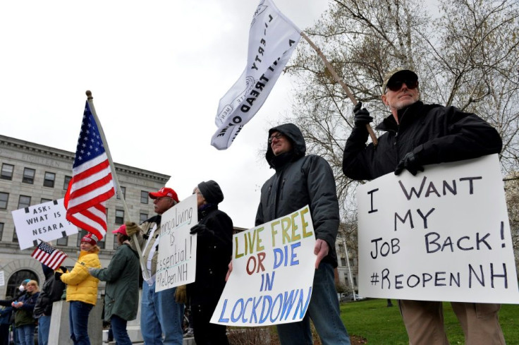 Hundreds of New Hampshire residents rallied outside the statehouse in Concord on April 18, 2020 to urge a quick end to the northeastern state's virus-related stay-at-home rule; similar protests have spread across the country