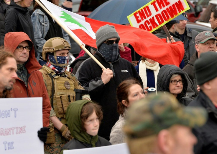 Some at the Concord, New Hampshire rally against home confinement rules wore masks or face coverings