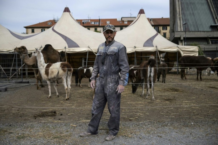 Circus director Derek Coda Prin poses in the "Circo Millennium" which is stuck in Savona, northwestern Italy, during a lockdown to fight the novel coronavirus. The fairgrounds cannot perform their show and the animals need more food.