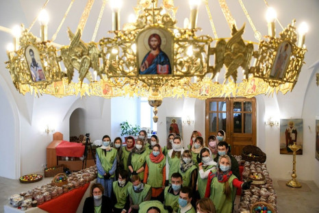 Russian Orthodox volunteers were among the few allowed into church for Easter preparations in Moscow