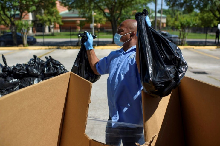 A worker prepares to hand out food in Houston, Texas