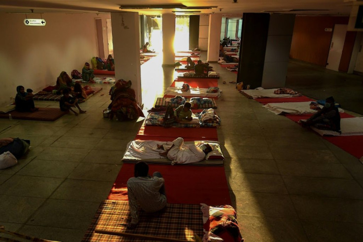 About 900 men and women are sleeping on floors at Yamuna stadium in Delhi as India restricts their movement to prevent the spread of COVID-19