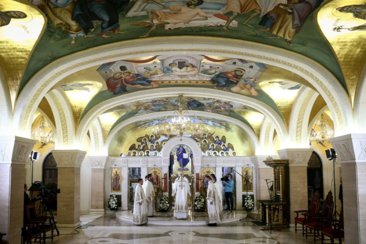 Serbian Orthodox Christian priests hold a morning Easter liturgy in the crypt of the cavernous Saint Sava Temple, one of the worldâs largest Orthodox houses of worship, in Belgrade