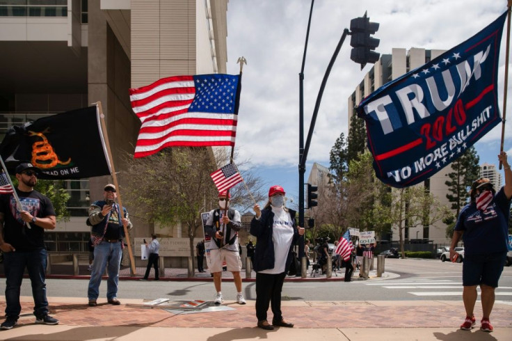 Protesters rally in downtown San Diego against California's stay at home order to prevent the spread of the novel coronavirus, on April 18, 2020