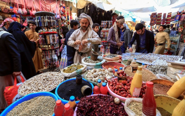 Yemenis shop in the old city market of the capital Sanaa ahead of the holy month, which is usually marked by large evening family and community meals