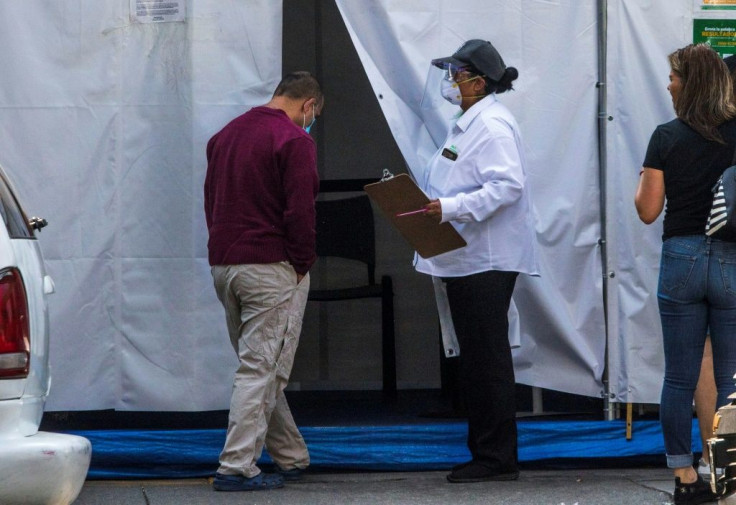 A man enters to a private clinic to take a coronavirus test in Mexico City, on April 19, 2020, during the novel coronavirus COVID-19 pandemic