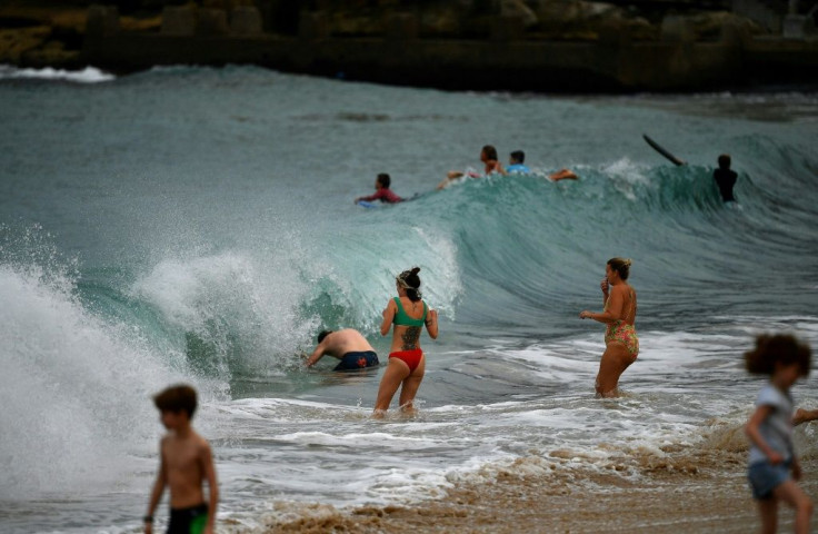 In Australia, authorities in Sydney reopened three beaches for walking, running, swimming or surfing