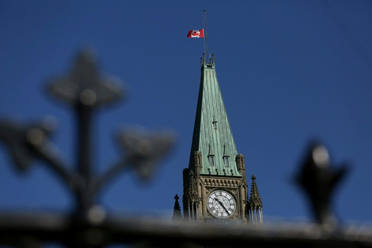 A Canadian flag flies at half-mast on top of the Peace Tower to mourn the victims of the of the Nova Scotia shooting April 20, 2020 in Ottawa, Canada