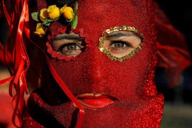 An activist takes part in a protest against gender violence and the government in Santiago on November 29, 2019