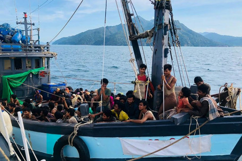 Malaysian authorities have arrested two people suspected of being human traffickers in connection with the arrival of this boat crammed with Rohingya migrants in Langkawi on April 5