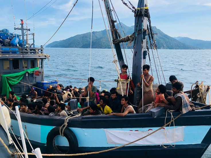 Malaysian authorities have arrested two people suspected of being human traffickers in connection with the arrival of this boat crammed with Rohingya migrants in Langkawi on April 5