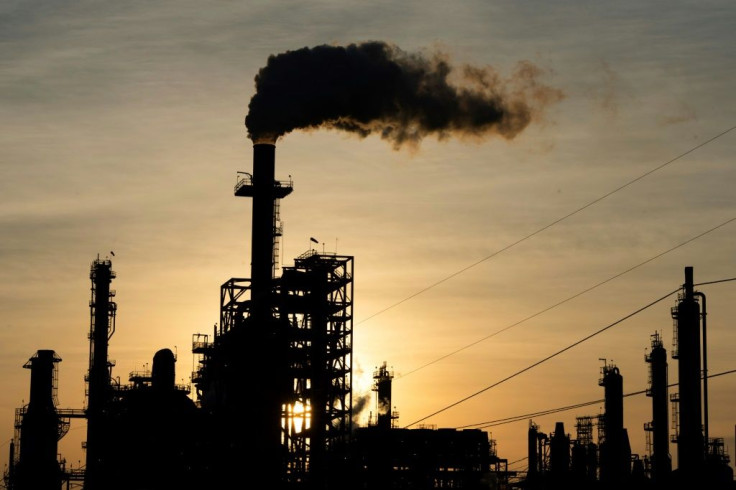 The sun sets behind smoke rising from the LyondellBasell-Houston Refining plant in Houston, Texas, as US crude futures fell below zero for the first time
