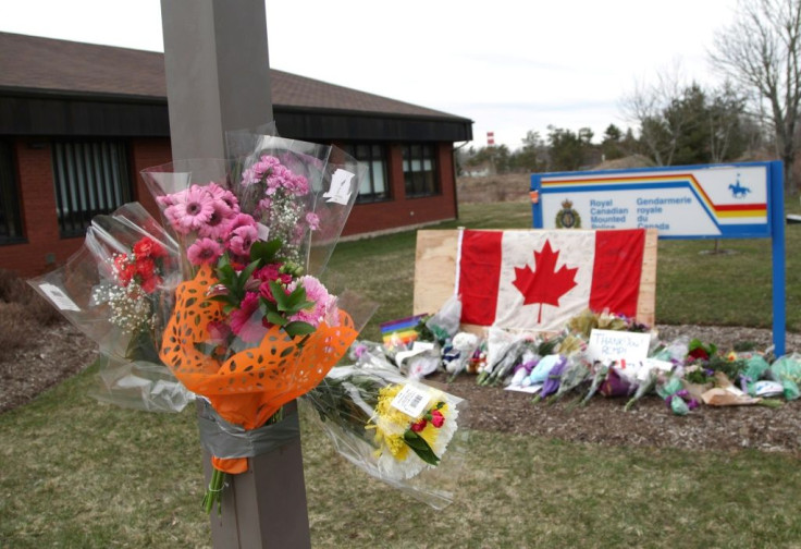 A makeshift memorial sits in front of the RCMP detachment in Enfield, Nova Scotia