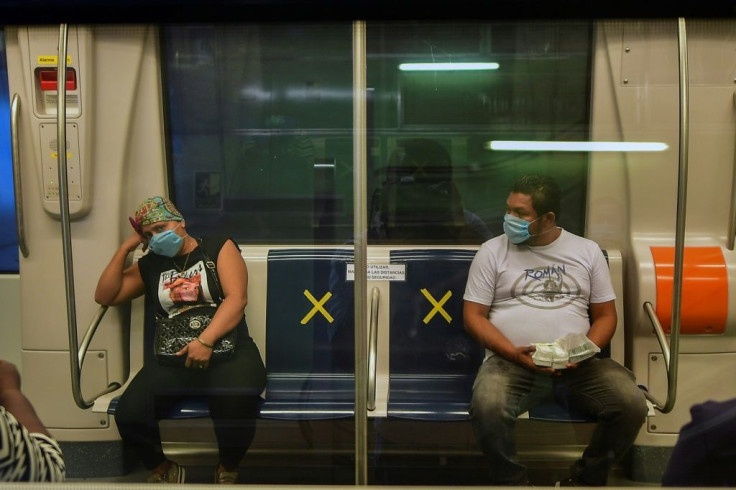 Passengers wear facemasks against the spread of coronavirus on the Panama City metro