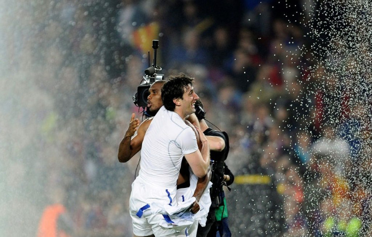 The Camp Nou sprinklers could not dampen the joy of Samuel Eto'o, who had been forced out of Barcelona the previous, and unlikely hero Diego Milito