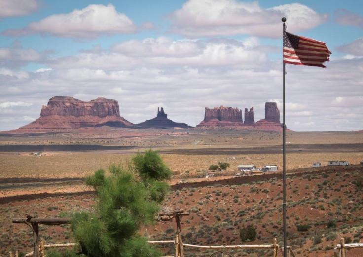Rock formations are seen behind the American flag at Gouldings Lodge and Trading Post in Monument Valley Navajo Tribal park, Utah, in 2014