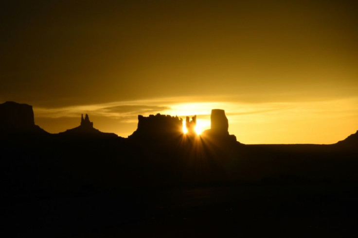 The sun rises over the Monument Valley in April, 2018