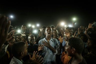 The AFP photo of Mohamed Youssef reciting a poem at a Khartoum demonstration on June 19, 2019, became an iconic image of the Sudanese revolution