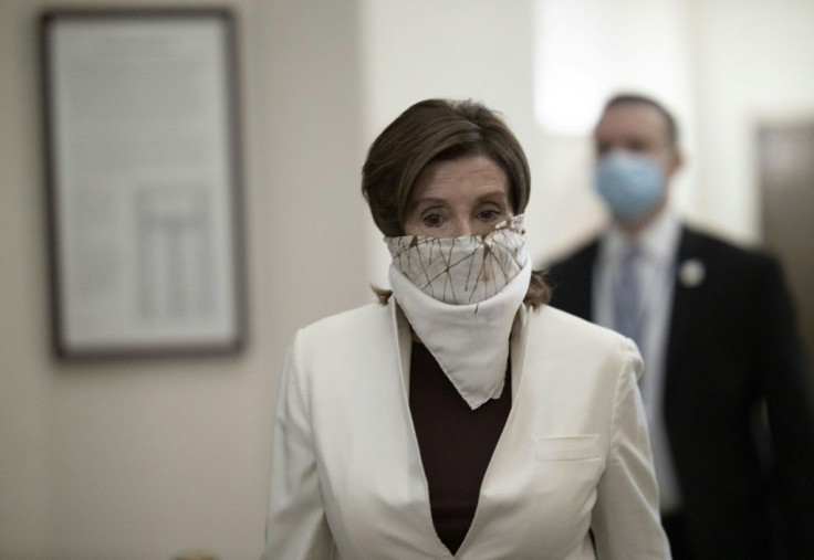 Democratic Speaker of the House Nancy Pelosi wore a face covering as she arrived on Capitol Hill to vote on the latest US stimulus bill