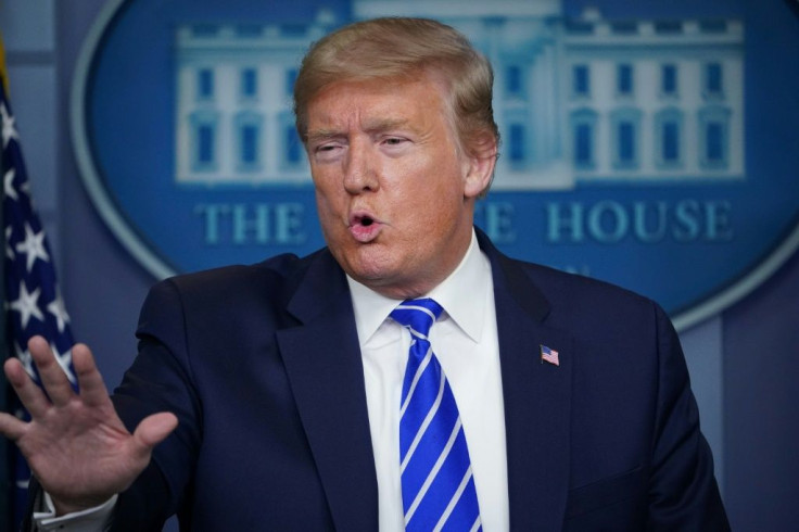 US President Donald Trump addresses reporters at the White House