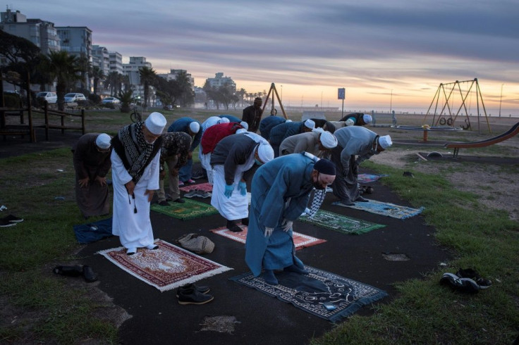 Muslims pray in Cape Town before looking for the crescent moon that signals the start of Ramadan
