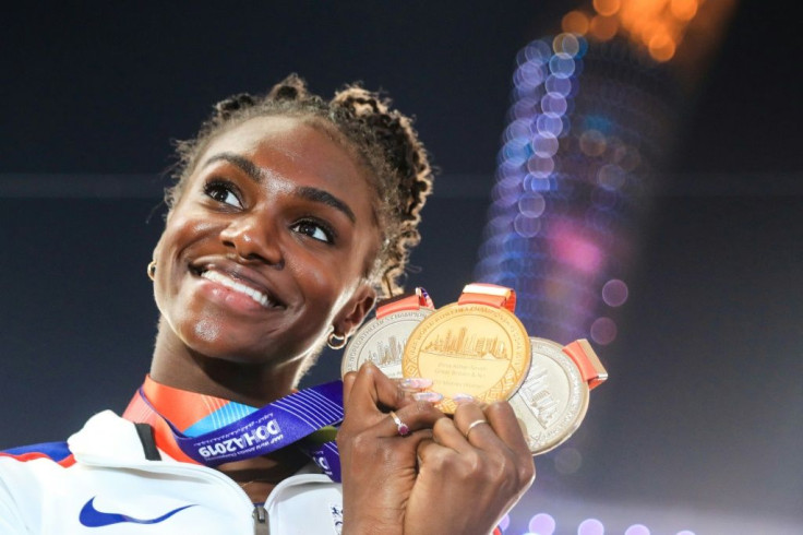 Britain's Dina Asher-Smith poses with her gold medal after winning the 200m at the 2019 world championships