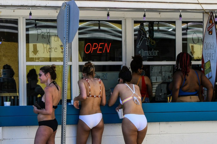 Beachgoers order drinks at a bar on Tybee Island, Georgia on April 25, 2020