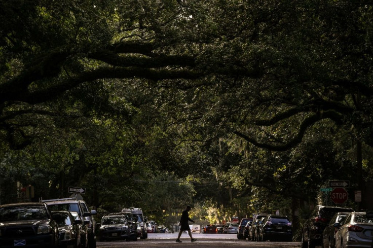 A man walks in the historic district in Savannah, Georgia, where the coronavirus pandemic has hit the tourist-focused city hard