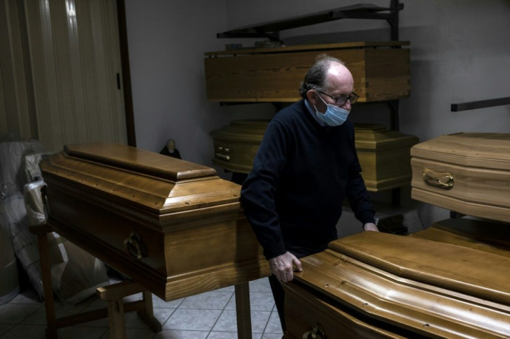 Giampiero Palmero, owner of a funeral home in Revello, laments having to seal coffins quickly before family can bid farewell to loved ones, as the coronavirus alters funeral traditions in Italy
