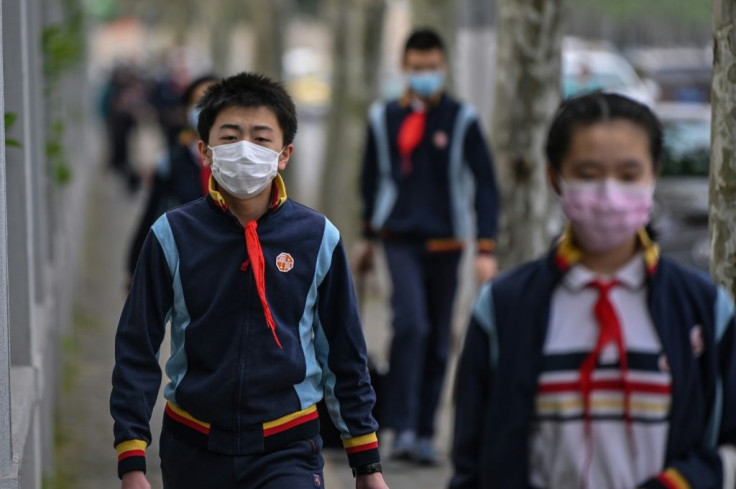 Back to school: Children in Shanghai and Beijing have been studying at home for months