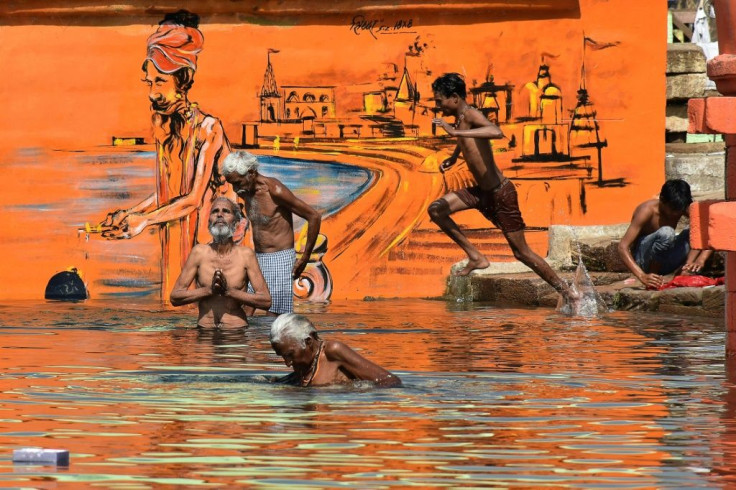 Hindu devotees bathe in Jabalpur on the occasion of Akshaya Tritiya, a annual spring festival which is believed to bring good luck and success, during the nationwide lockdown in India