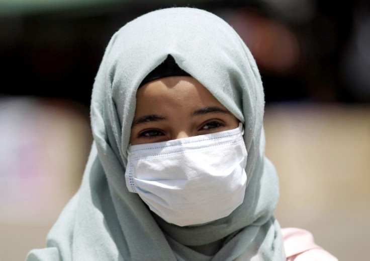 A Yemeni girl wears a protective face mask in the capital Sanaa amid concerns over the spread of the novel coronavirus