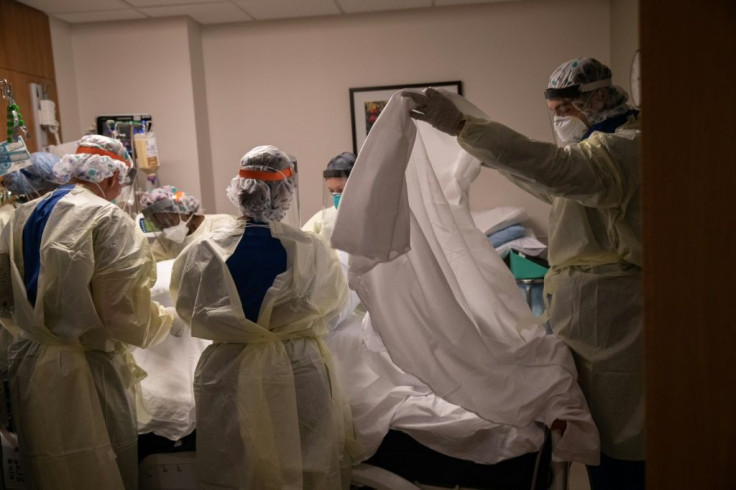 A medical team turns over a patient with COVID-19 in an intensive care unit  in Stamford, Connecticut