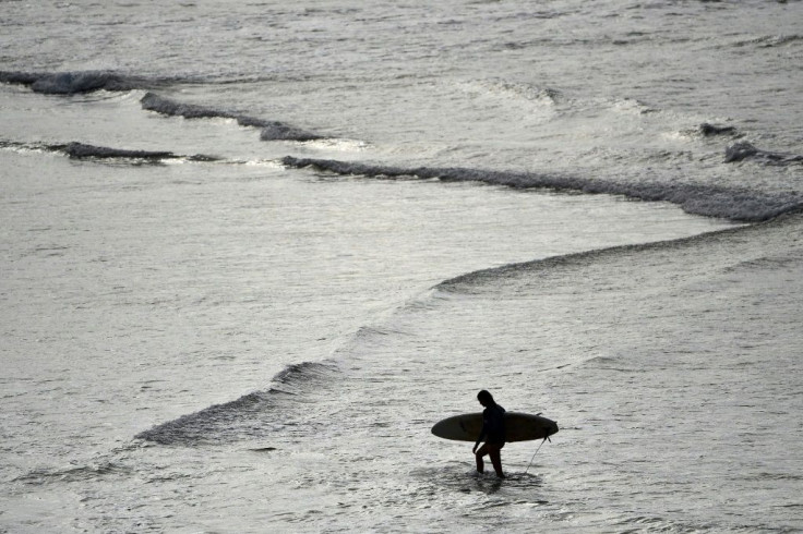 Surfers rushed to Sydney's famous Bondi beach as Australia took its first steps in easing coronavirus restrictions