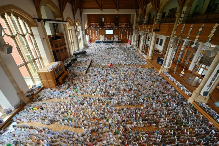 A selection of over 125,000 birthday cards sent to Captain Tom Moore, for his 100th birthday on April 30th, displayed in the Great Hall of Bedford School, in Bedford, north of London