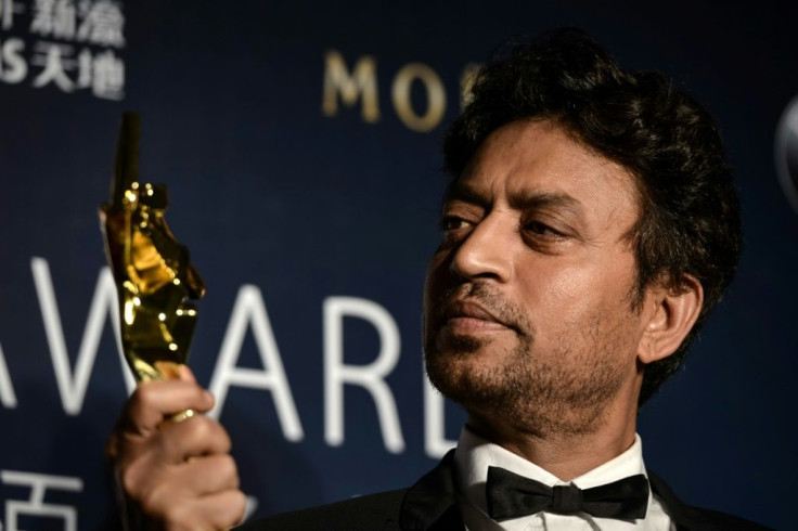Irrfan Khan poses with a statuette for Best Actor at the 2014 Asian Film Awards