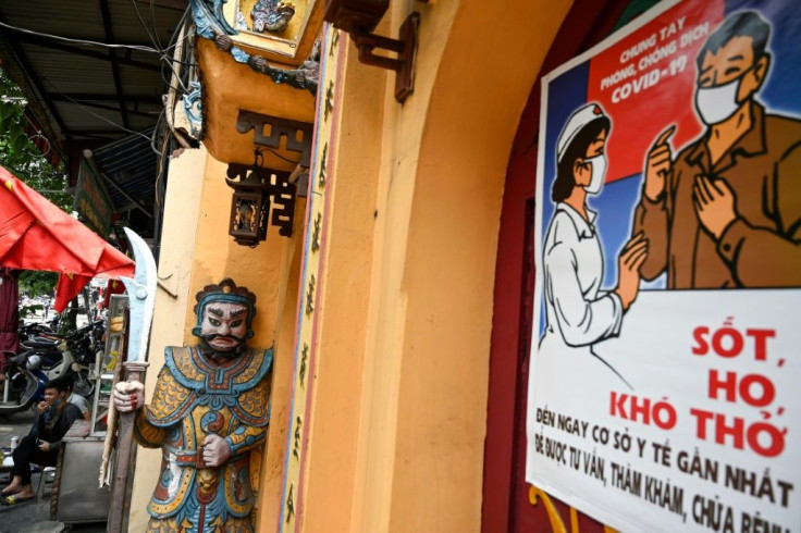 A stylised propaganda poster against  coronavirus in the old quarter of Hanoi