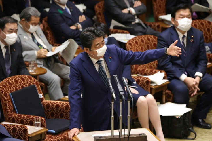 Abe told parliament: 'We must hold the Olympics as a testament to humanity's victory over the coronavirus.'