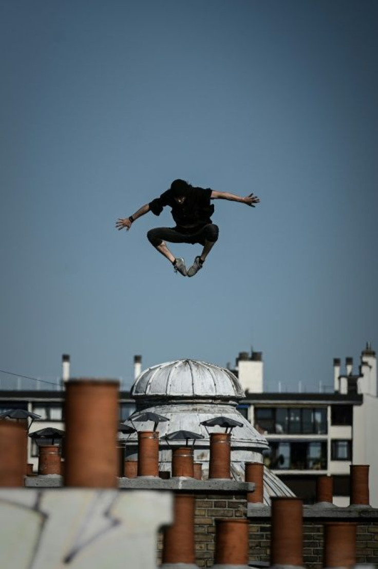Up on the roof: Nogueira leaps across the Paris skyline