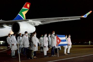 Cuban medial workers at the Waterkloof Air Force Base in Pretoria on April 27, 2020 to support coronavirus efforts in a photo released by the South African government