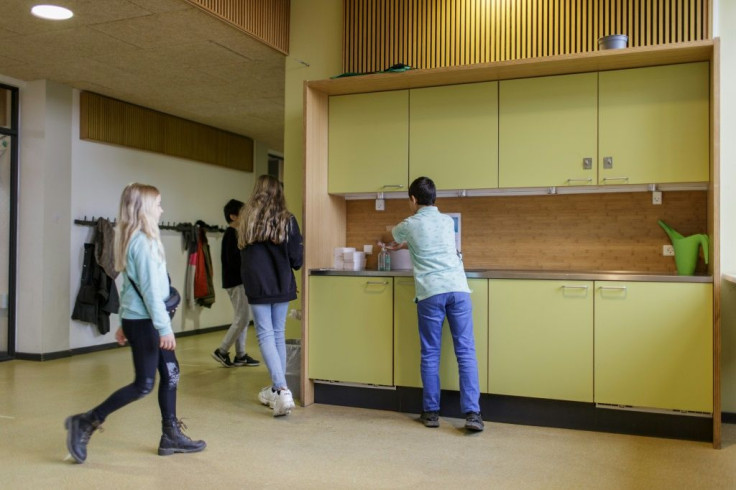 With social distancing and handwashing still de rigueur, pupils wash their hands before heading out to lessons