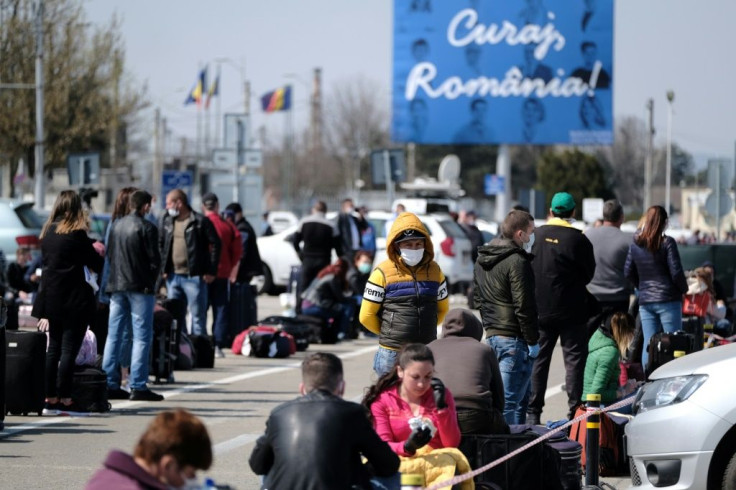 Images of around 2,000 seasonal workers waiting shoulder-to-shoulder in a packed airport car park spread quickly