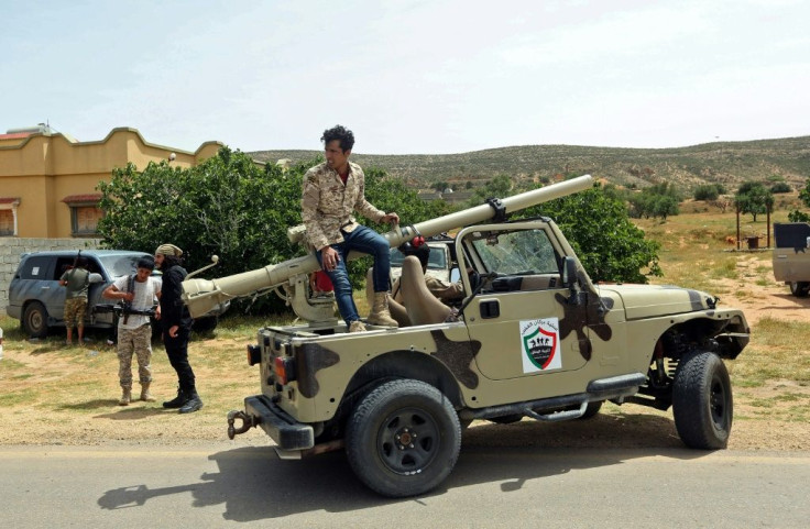 Fighters for Libya's UN-recognised Government of National Accord (GNA) gather at a position near the town of Garabulli, some 70km east of the capital Tripoli, amid battles with forces loyal to the Libyan strongman Khalifa Haftar earlier this month