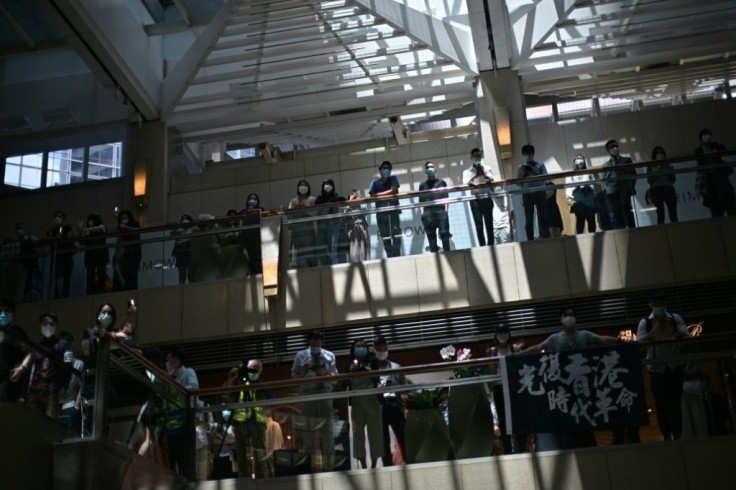 Pro-democracy supporters gather at a shopping mall during a lunchtime rally in Hong Kong on April 29